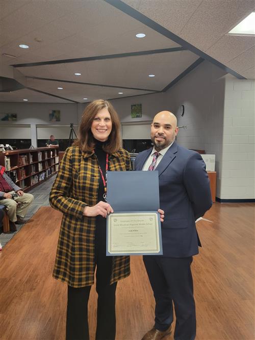 Photo of the January staff member of the month Linda Wilkins with the principal.